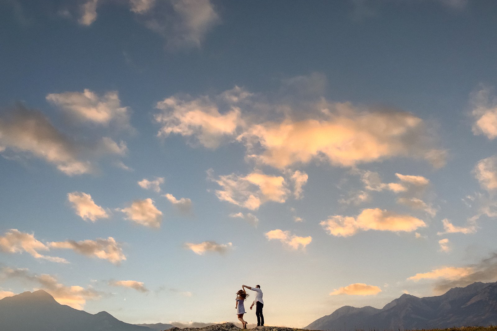 Man and Woman Dancing on mountaintop  | Jamie Robson Photography | Engagement Photographer in Jasper (Copy)