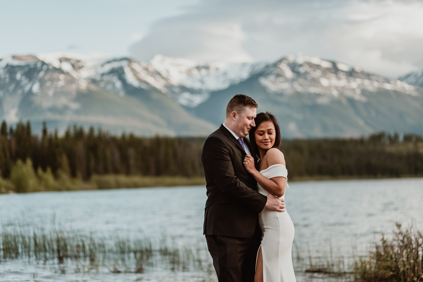 Bride and groom snuggling at Patricia Lake | Jamie Robson Photography | Elopement & Wedding Photographer in Jasper (Copy)