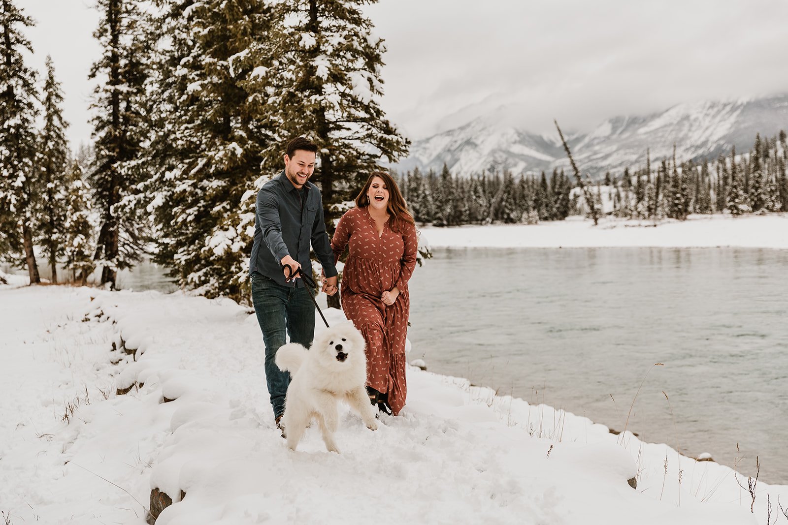 Man and woman walking their dog in the rocky mountains | Jamie Robson Photography | Maternity Photographer in Jasper (Copy)