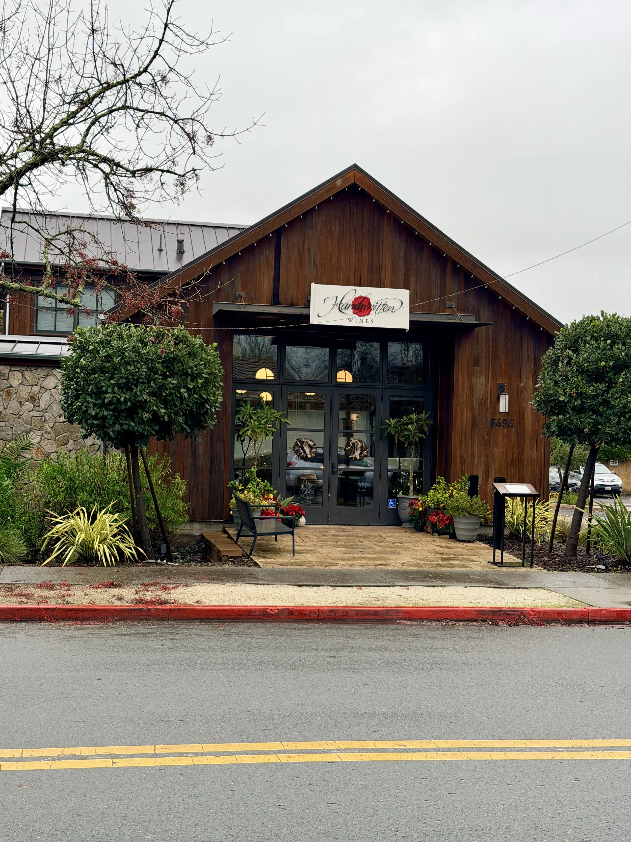 Front entrance exterior of Handwritten Wines Tasting Room in Yountville near Napa