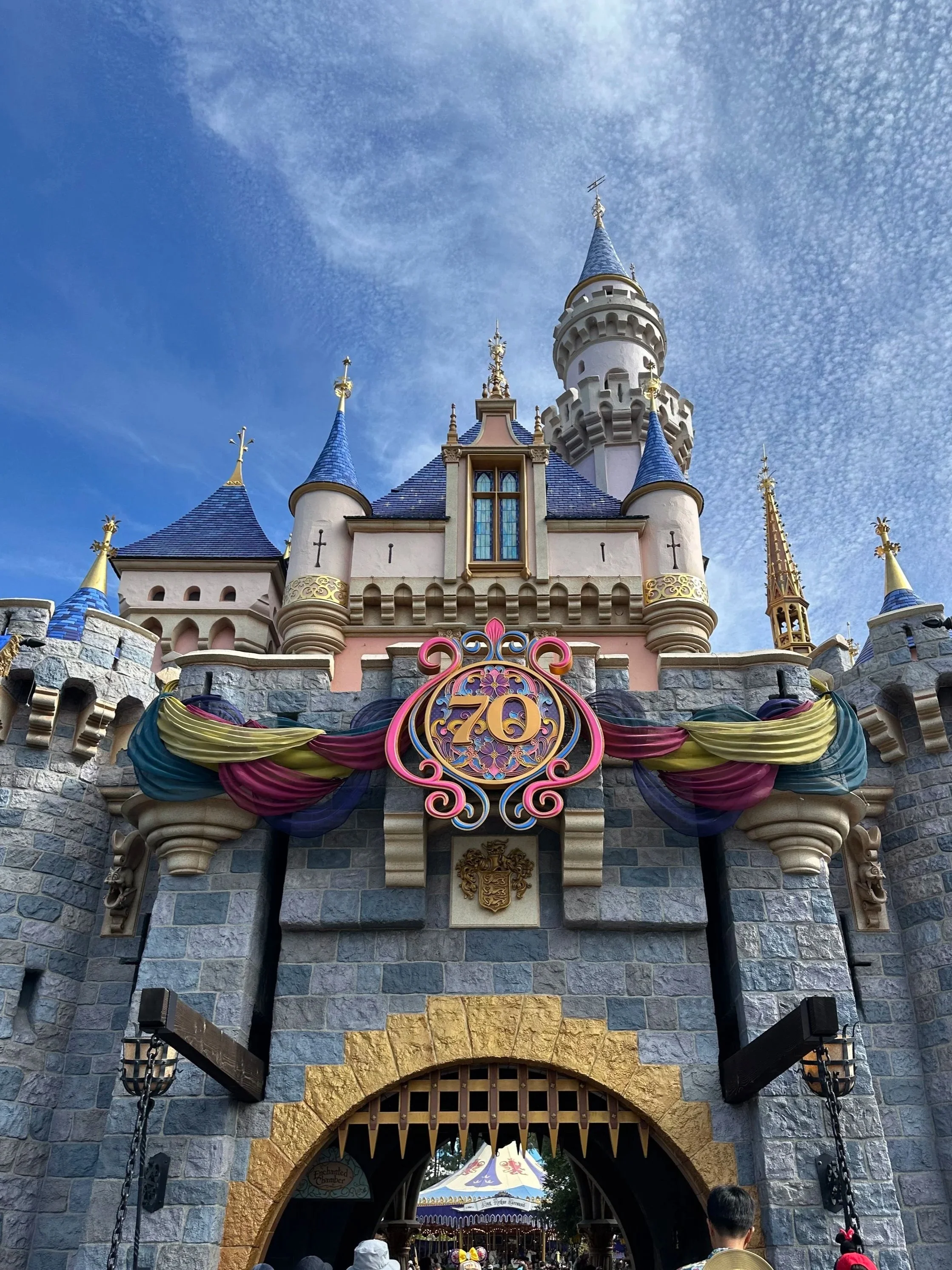 Sleeping Beauty's castle decorated for the 70th Anniversary celebration at Disneyland.
