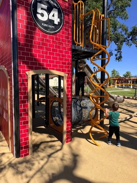 Toddlers and young kids playing on the playground at Dizdar Park in Camarillo, California - great stop for active kids