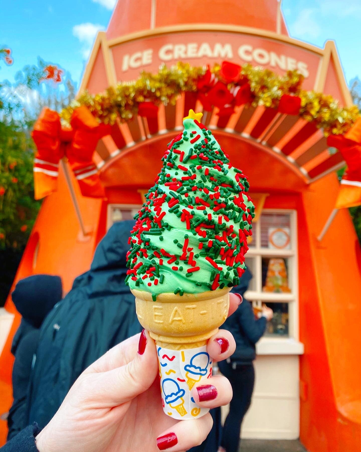Peppermint Ice Cream Cone with Christmas Sprinkles and topped with