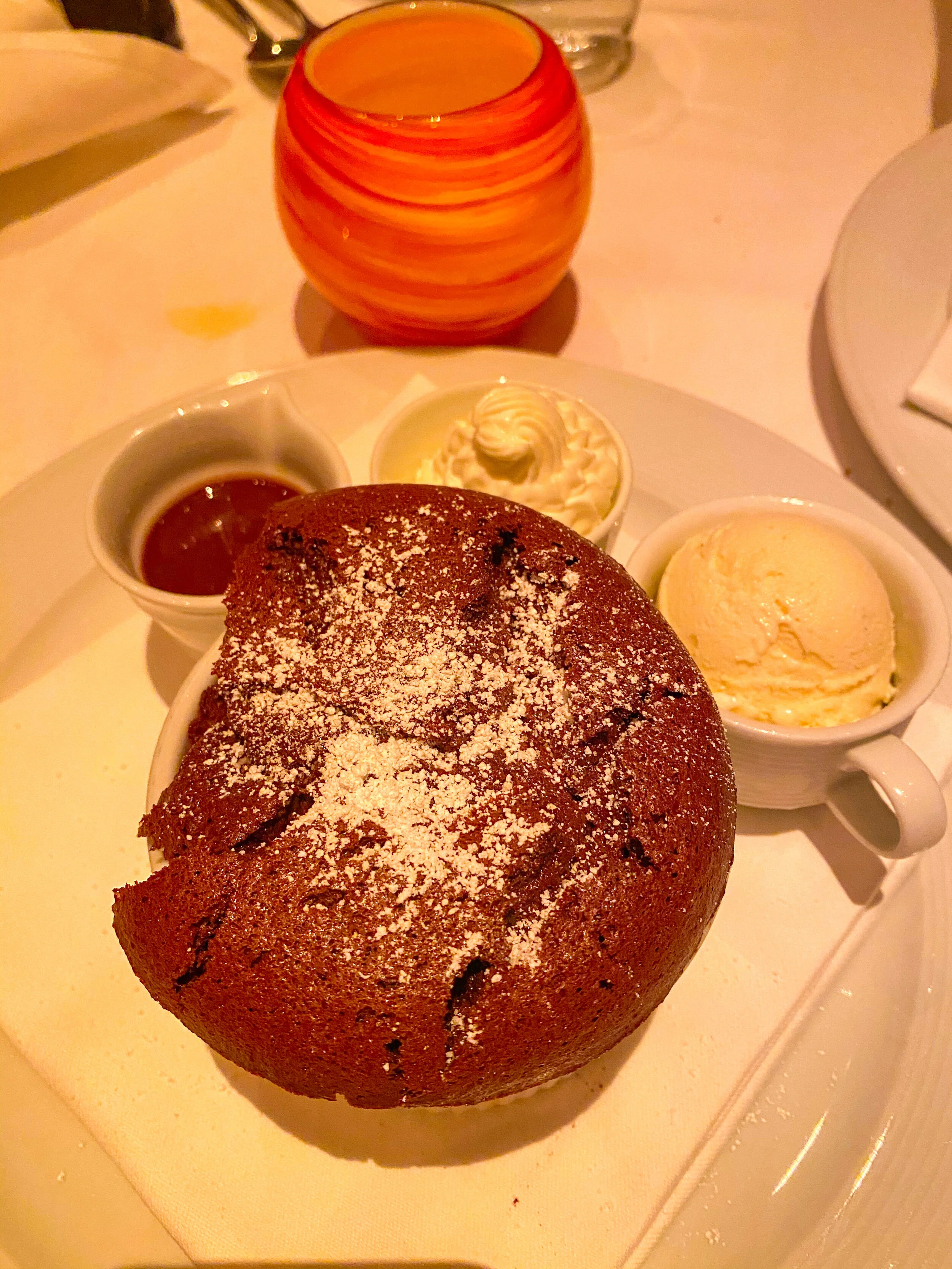 Valrhona chocolate soufflé at Spago Maui in Wailea topped with Guanaja chocolate sauce and vanilla ice cream.