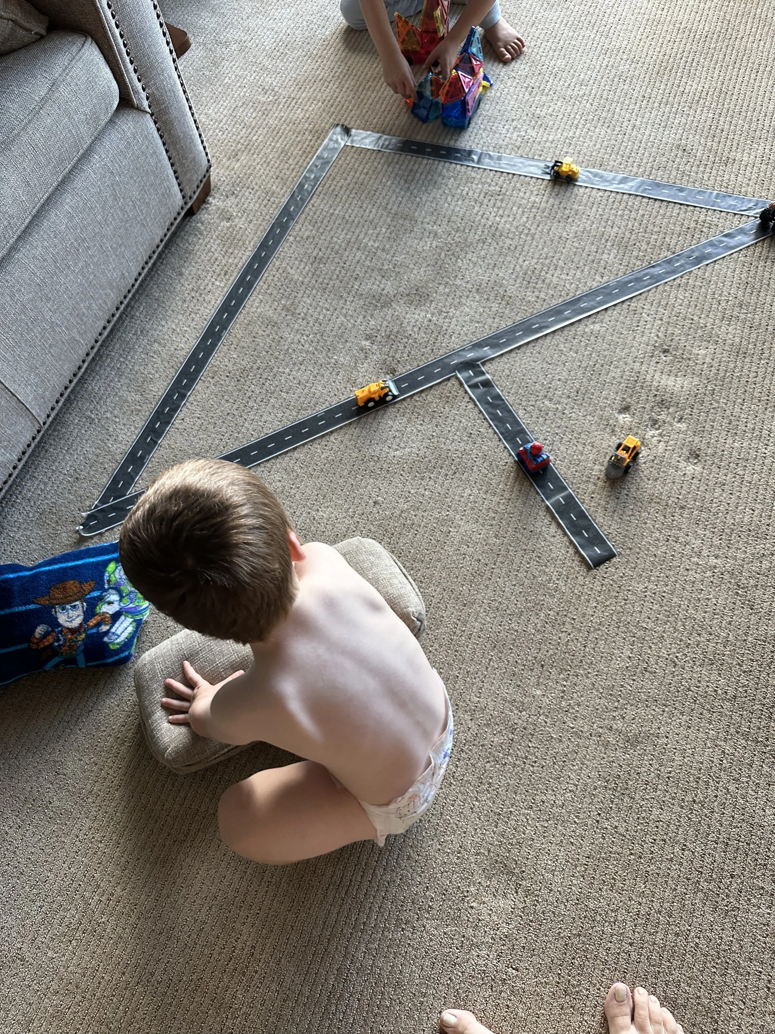 Tape that looks like Road that sticks to the carpet like painters tape