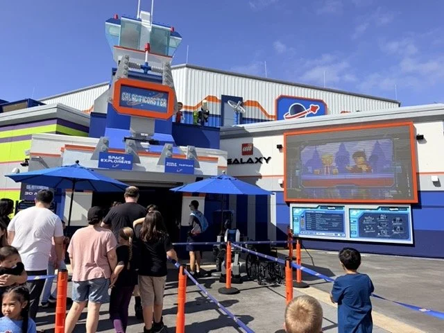 Galacticoaster entrance and interactive spaceship design screens in LEGO Galaxy at LEGOLAND California