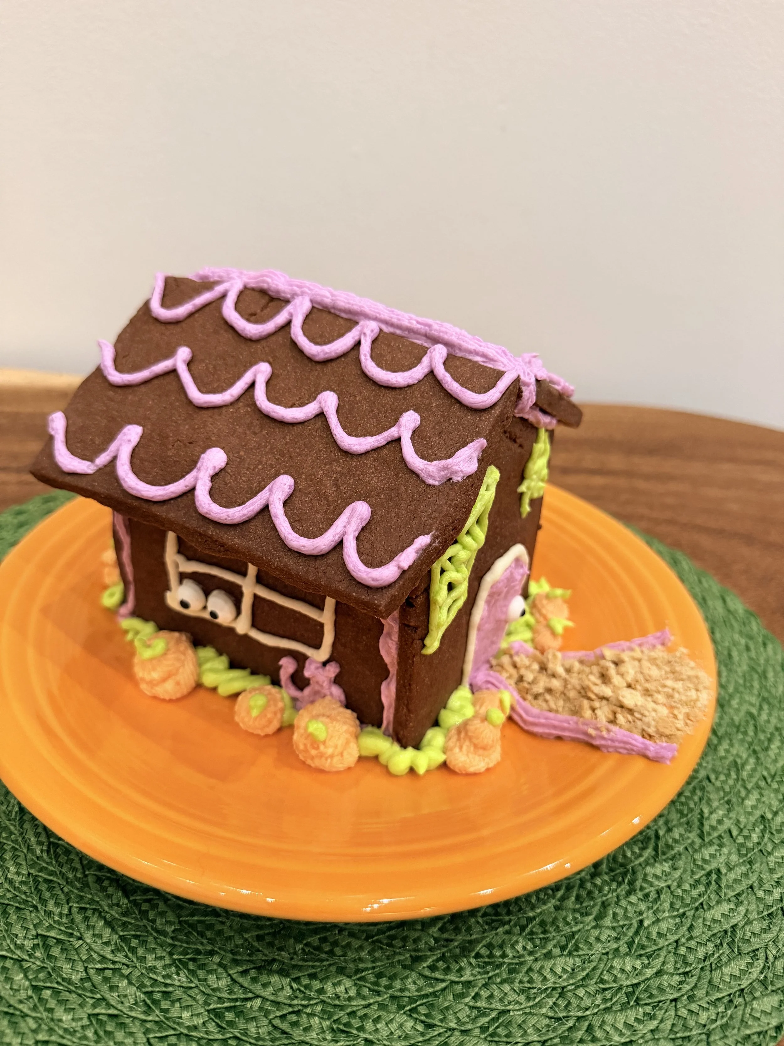 3D forsting pumpkins around a Halloween cookie house with a black cat