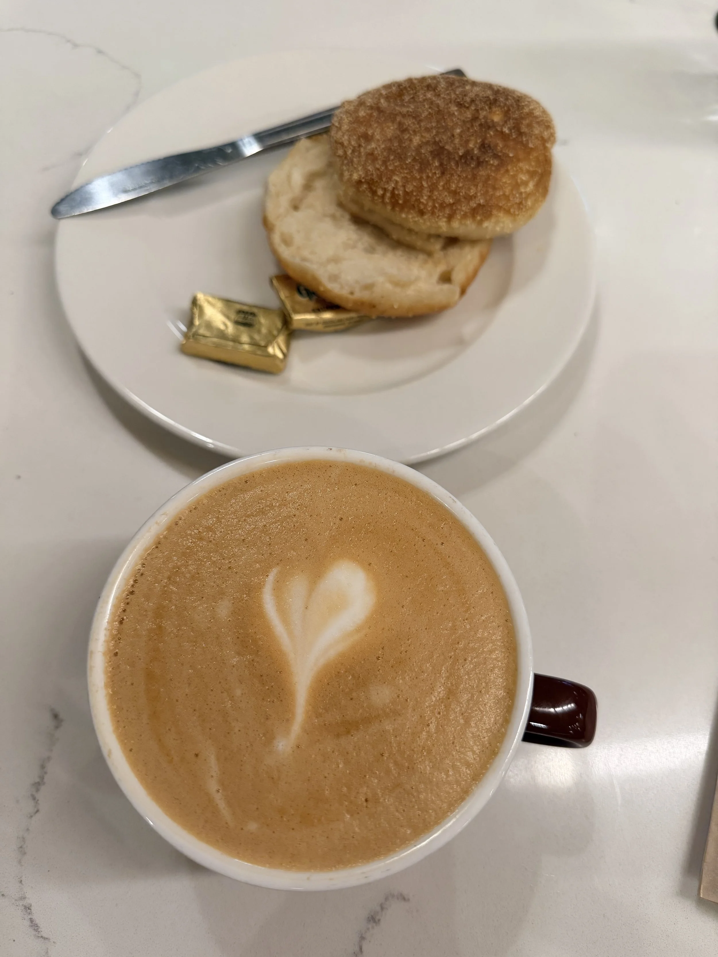 English Muffin and Latte with a heart art from Model Bakery