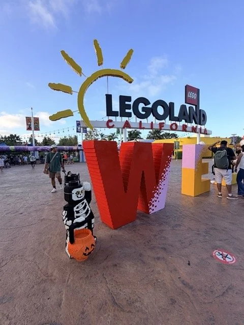 Halloween skeleton and pumpkin decoration at the LEGOLAND California entrance