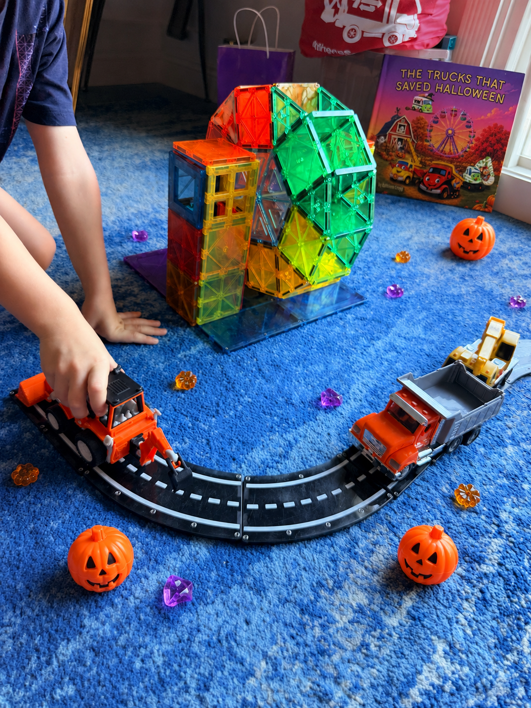 Halloween Carnival with toy trucks and a ferris wheel made of magnetic tiles