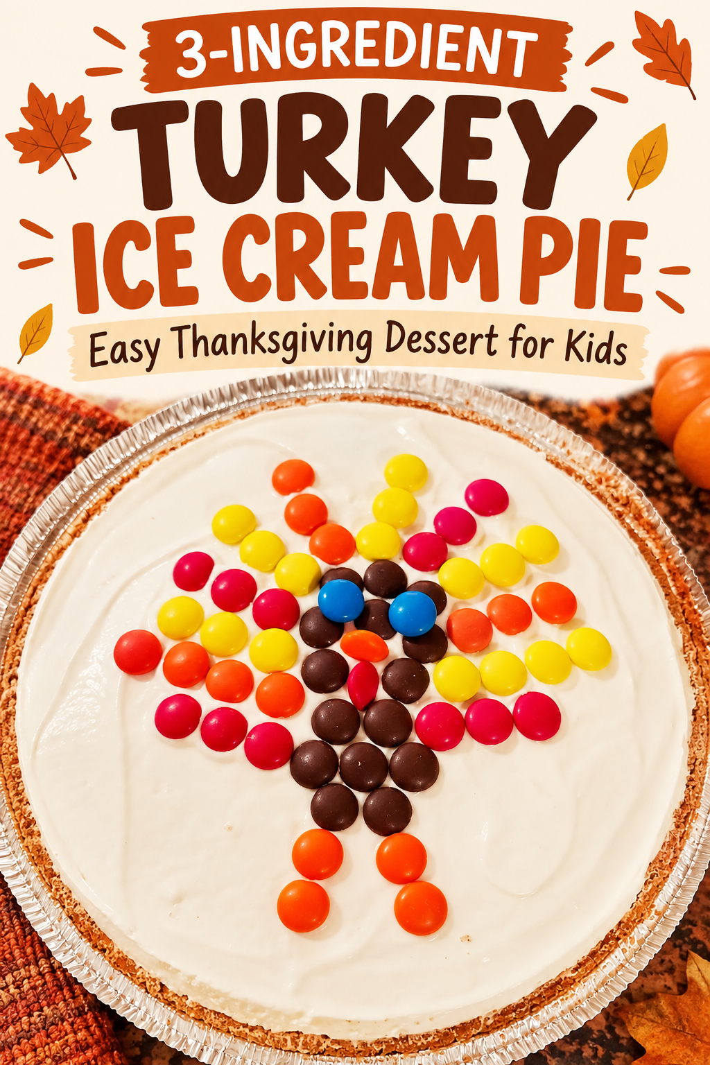 Easy Thanksgiving ice cream pie in a graham cracker crust decorated with colorful M&M’s arranged in the shape of a turkey. Text reads “3-Ingredient Turkey Ice Cream Pie — Easy Thanksgiving Dessert for Kids.”