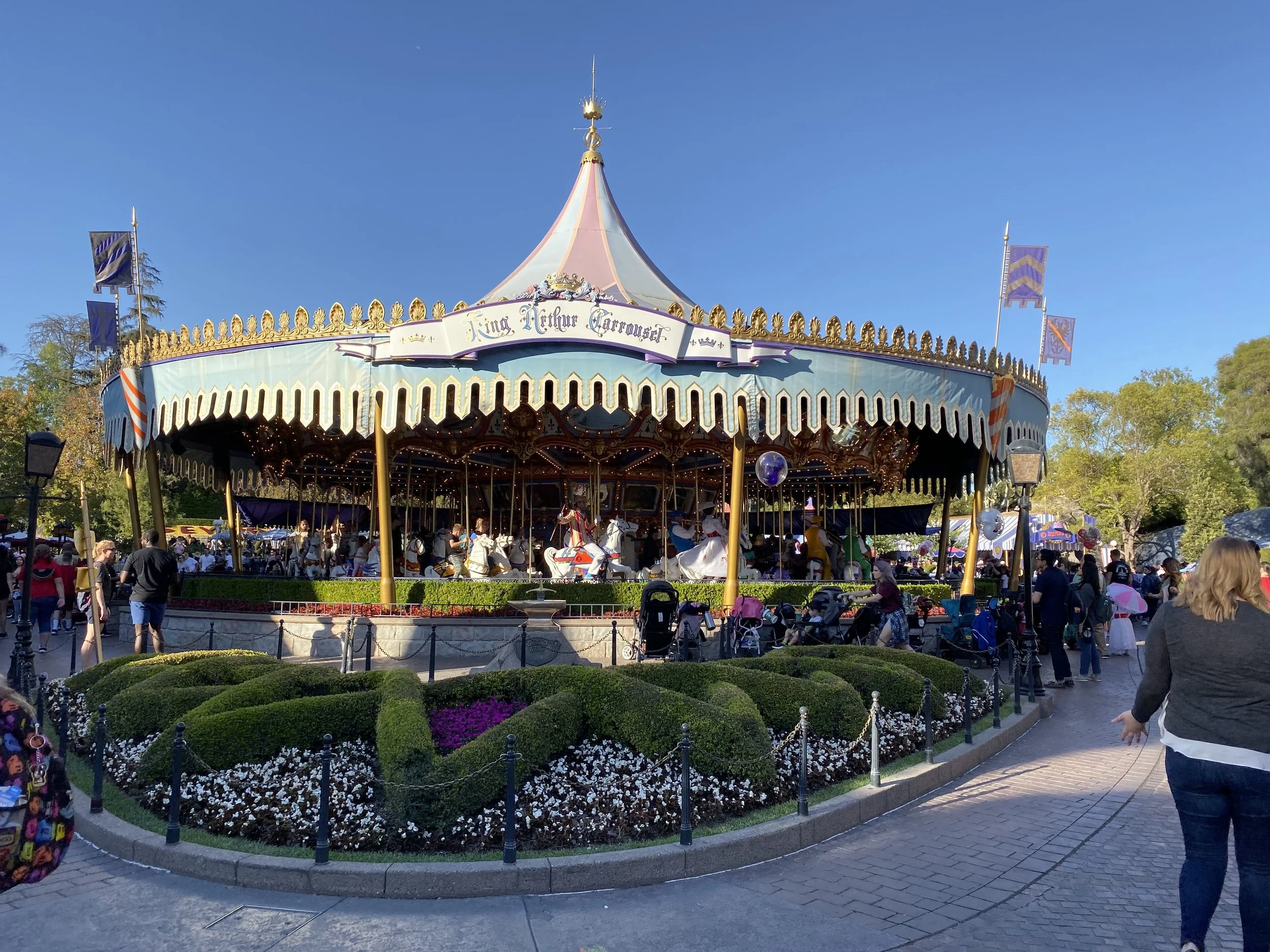 Mary Poppins and Bert ride the King Arthur Carousel at Disneyland in Fantasyland