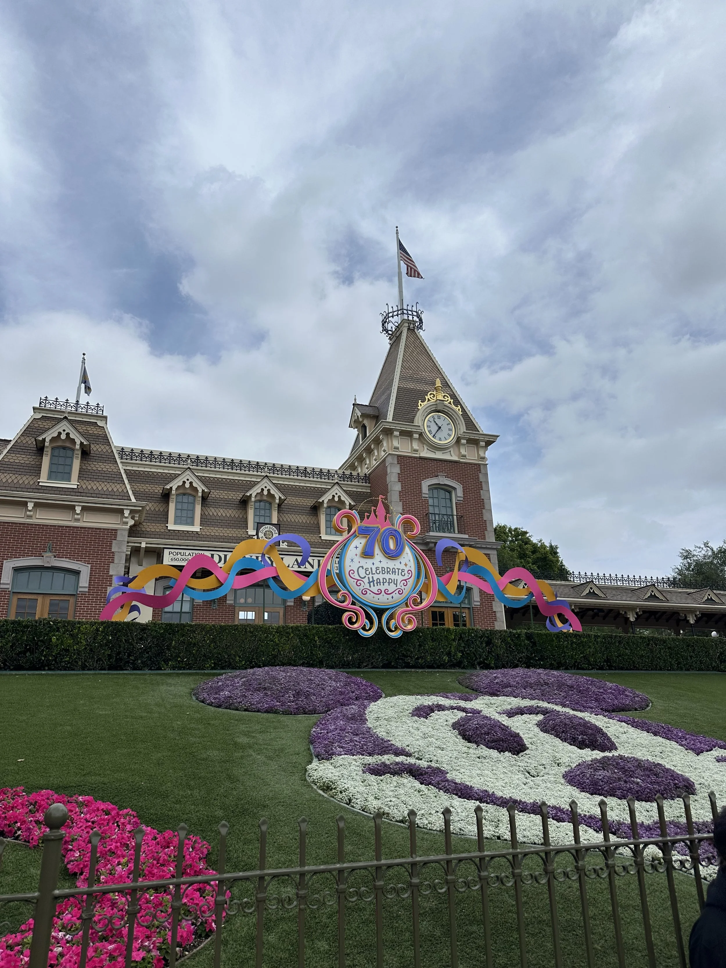 Mickey flowers in front of train station at Disneyland 70th anniversary