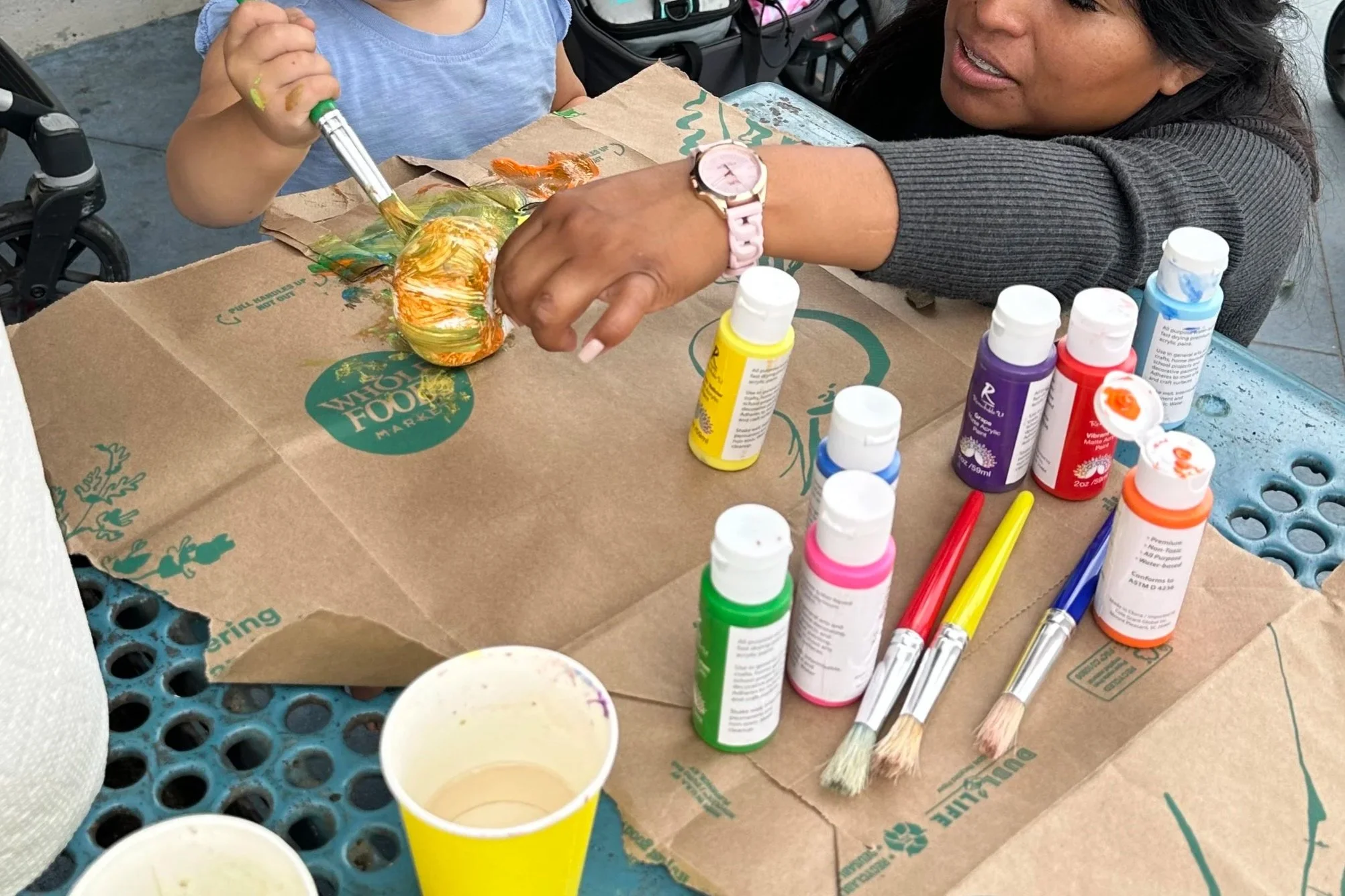 Toddlers Painting Pumpkins for Halloween