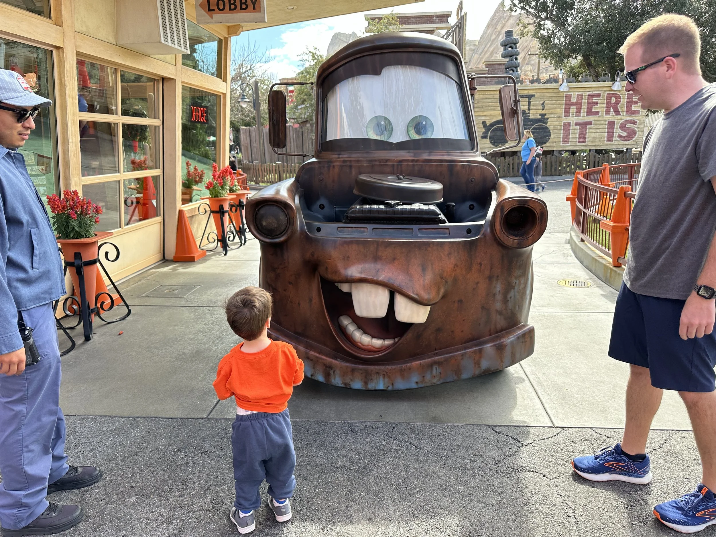 Toddler boy visiting Mater in Radiator Springs at California Adventure in the Disneyland Resort.