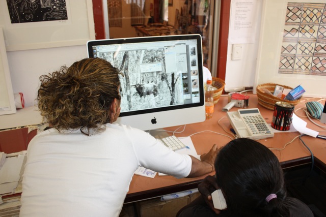  Ruby Djikarra Alderton assisting young artists with their photoshop stencils. 