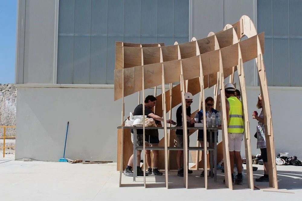 Team assembling the pavilion structure.