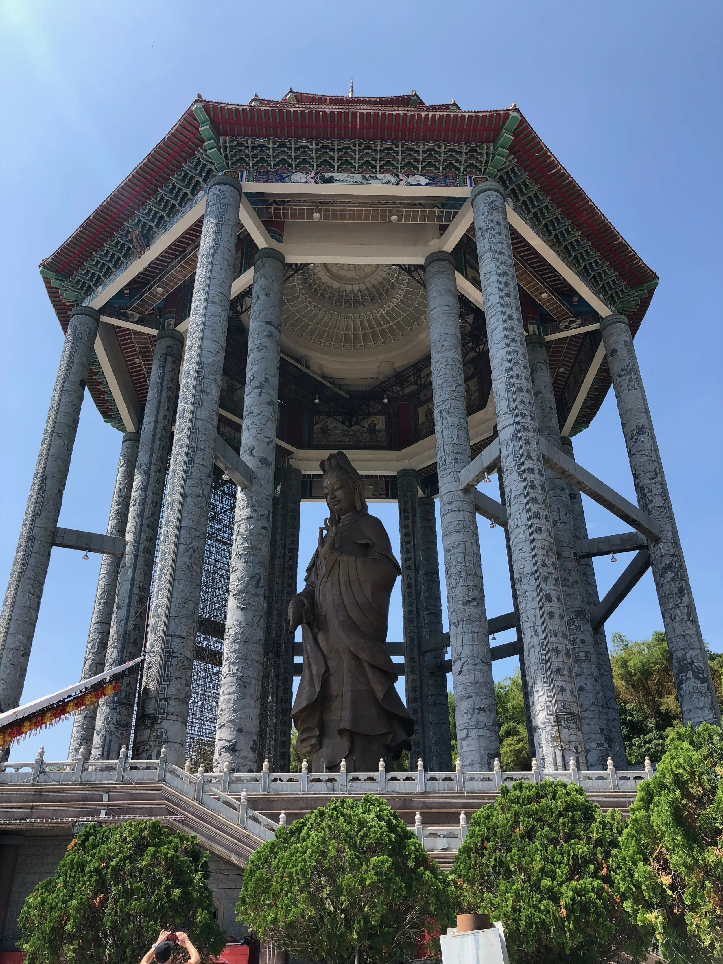 The statue of Kuan Yin within a pavilion. This behemoth of a statue was incredible to see, except there was no way to see it up close since the stairs leading to the statue were blocked.