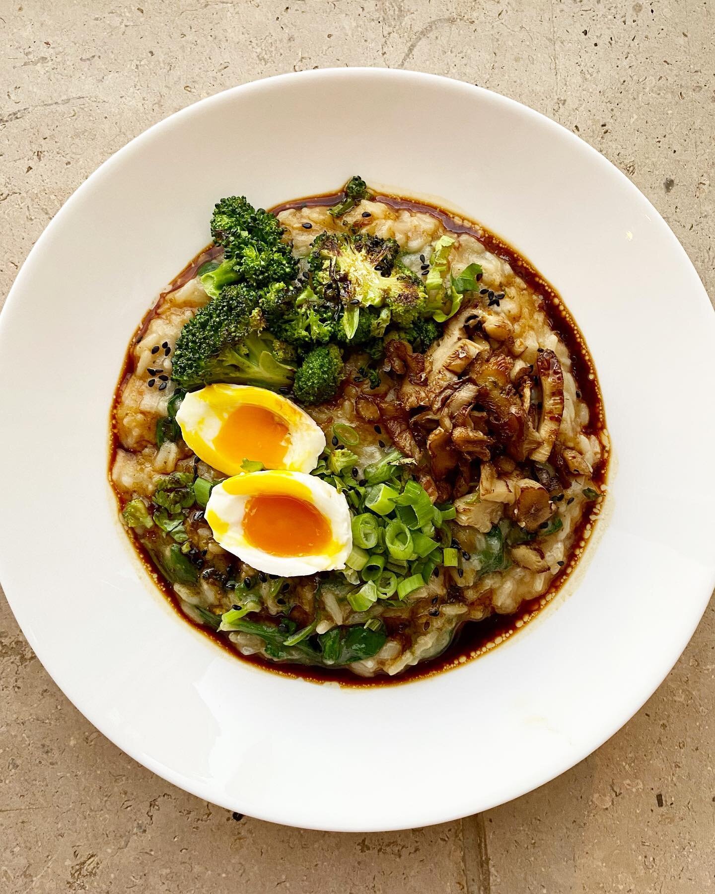 First attempt at congee and I&rsquo;m obsessed. Inspired by the Asian porridge queen @petrinanana - topped with soft boiled egg, oyster mushrooms, broccoli and spring onions, drenched in a sesame, soy and lime dressing.