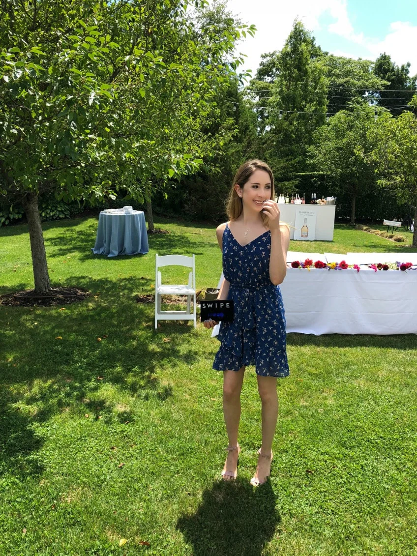 Wearing a Bloomingdale's/Aqua dress, Steve Madden sandals, and a Milly clutch