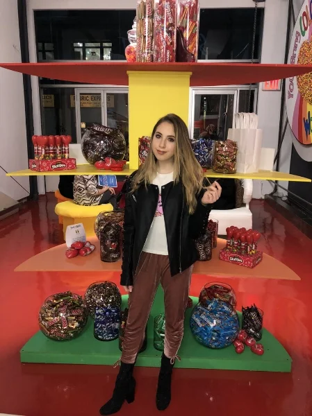 Wearing a leather jacket from Members Only and velvet joggers from Revolve