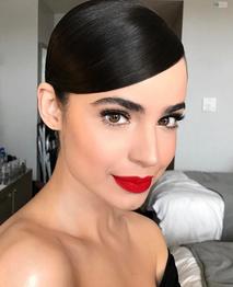 Sofia Carson wearing matte red lipstick
