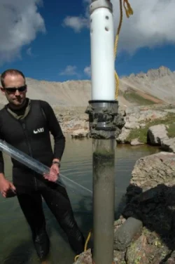 Dr. Jason Neff extracts sediment cores from Porphyry Lake in the San Juan Mountains of Colorado–Credit to Dan Fernandez