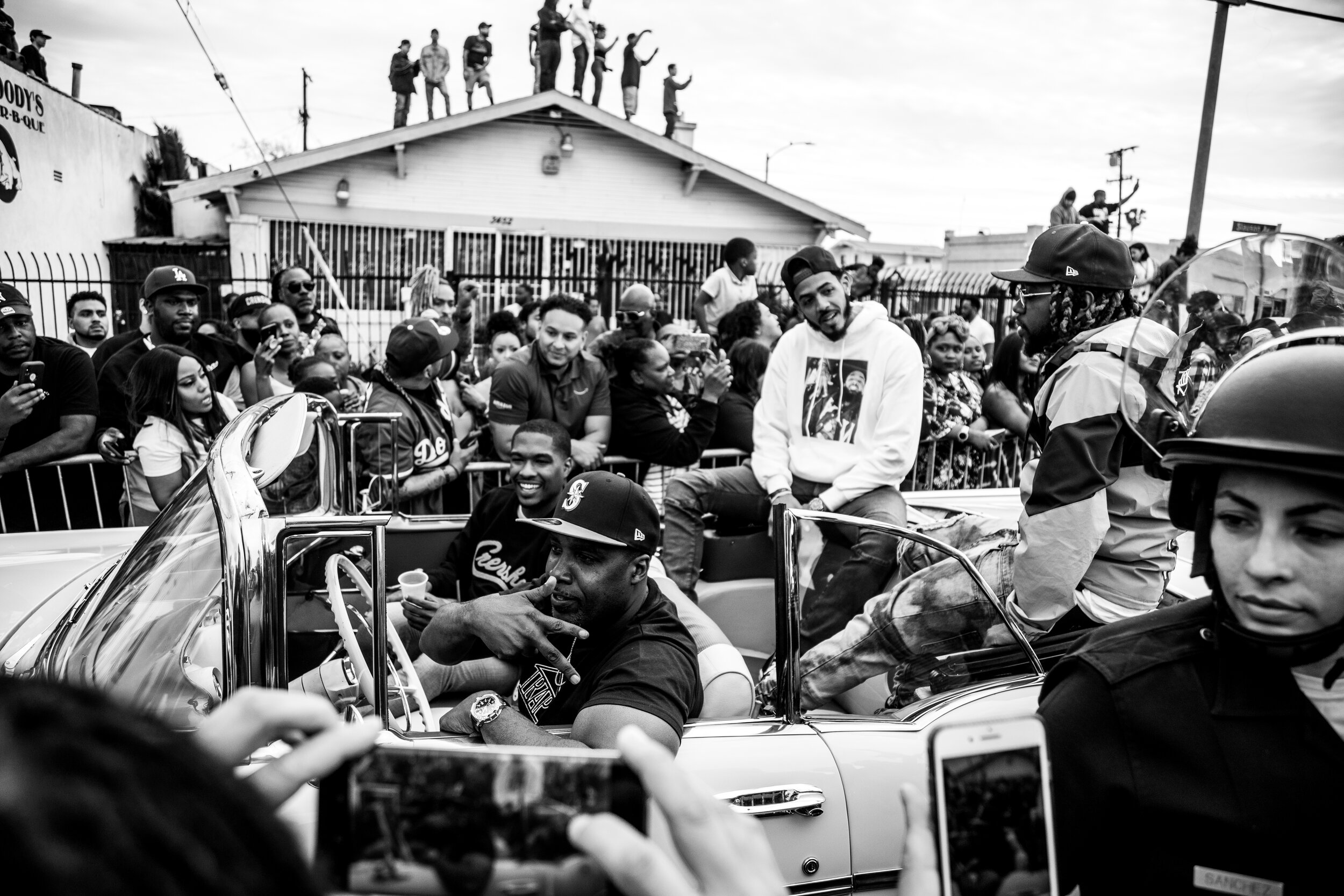  The Nipsey Hussle funeral procession moves down Slauson Avenue near The Marathon Clothing Store on April 11, 2019.   