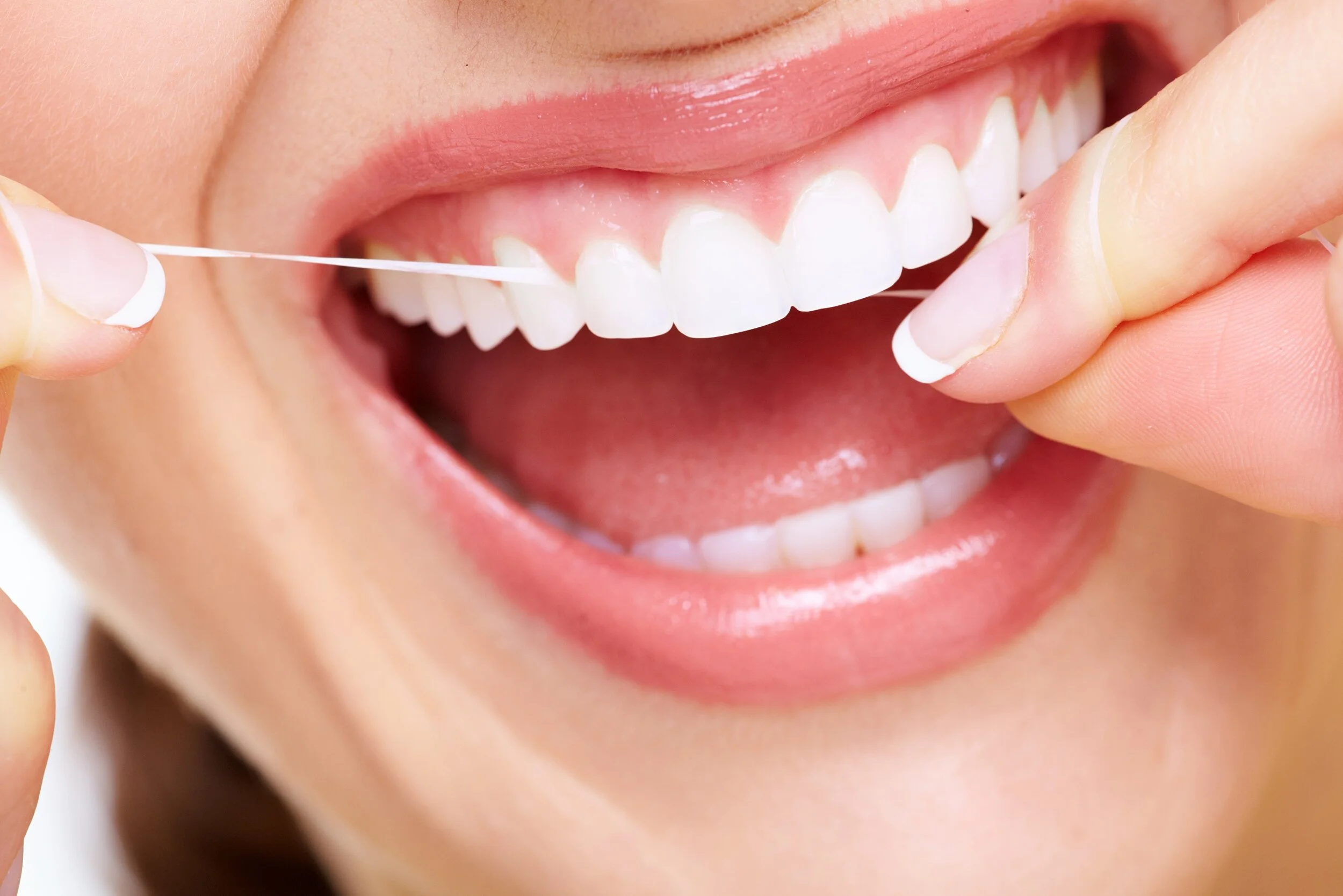 Flossing Daily Can Protect Your Smile