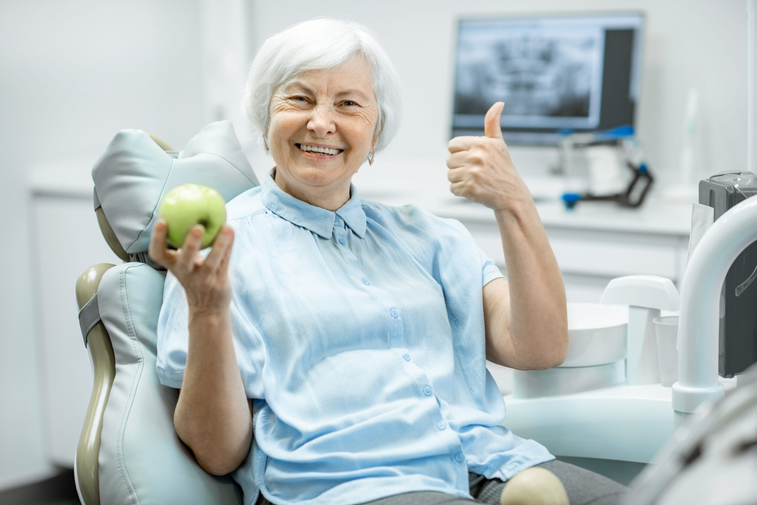 Should I Get Dental Implants or Dentures?