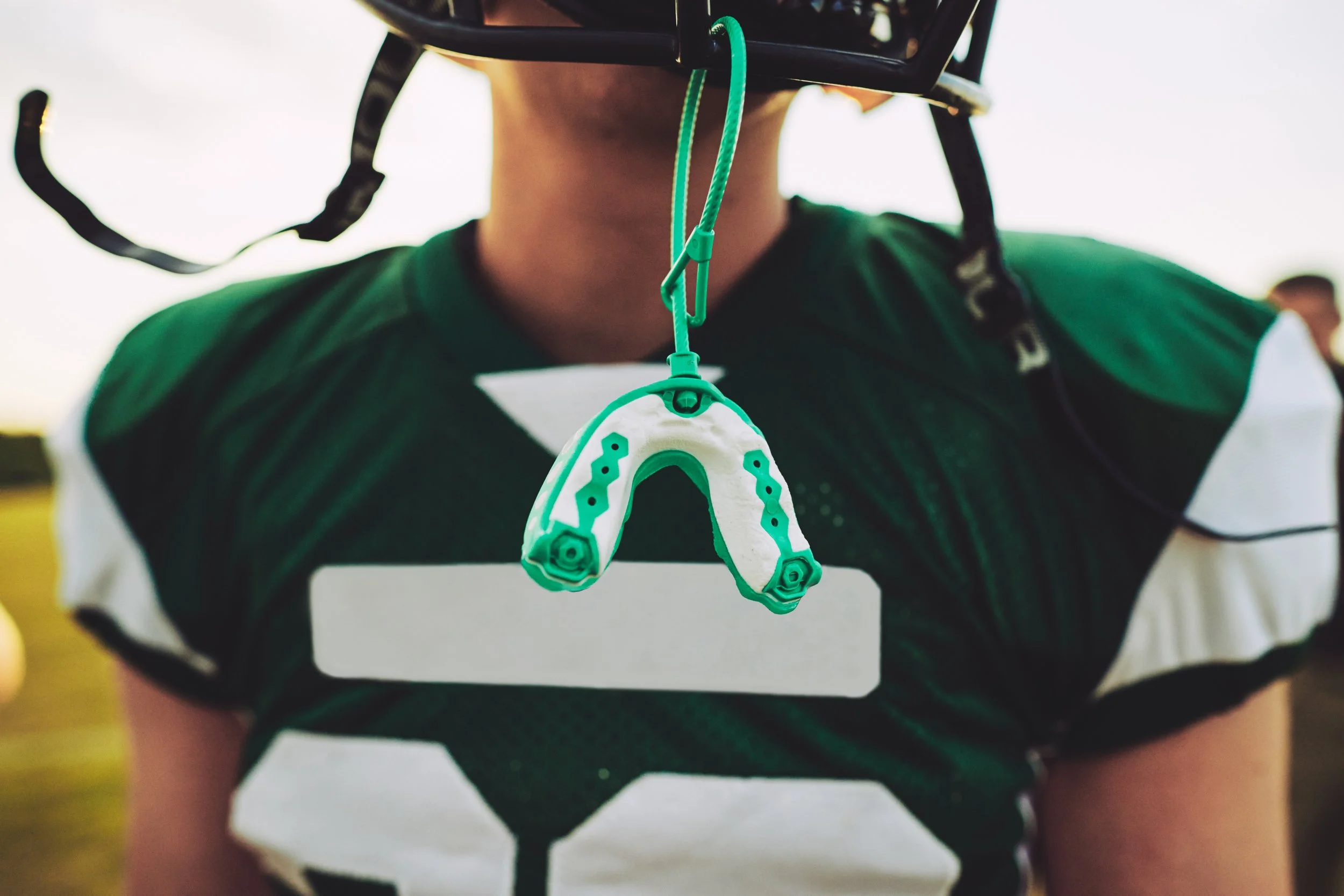 How do you care for a sports mouth guard?