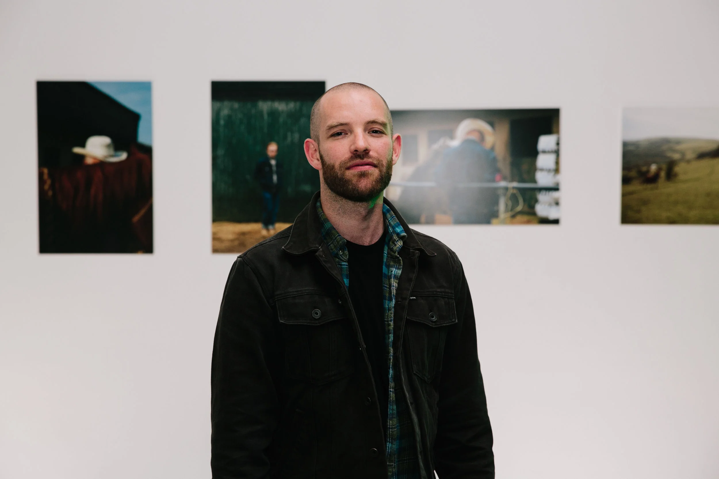 Andy in front of his images.