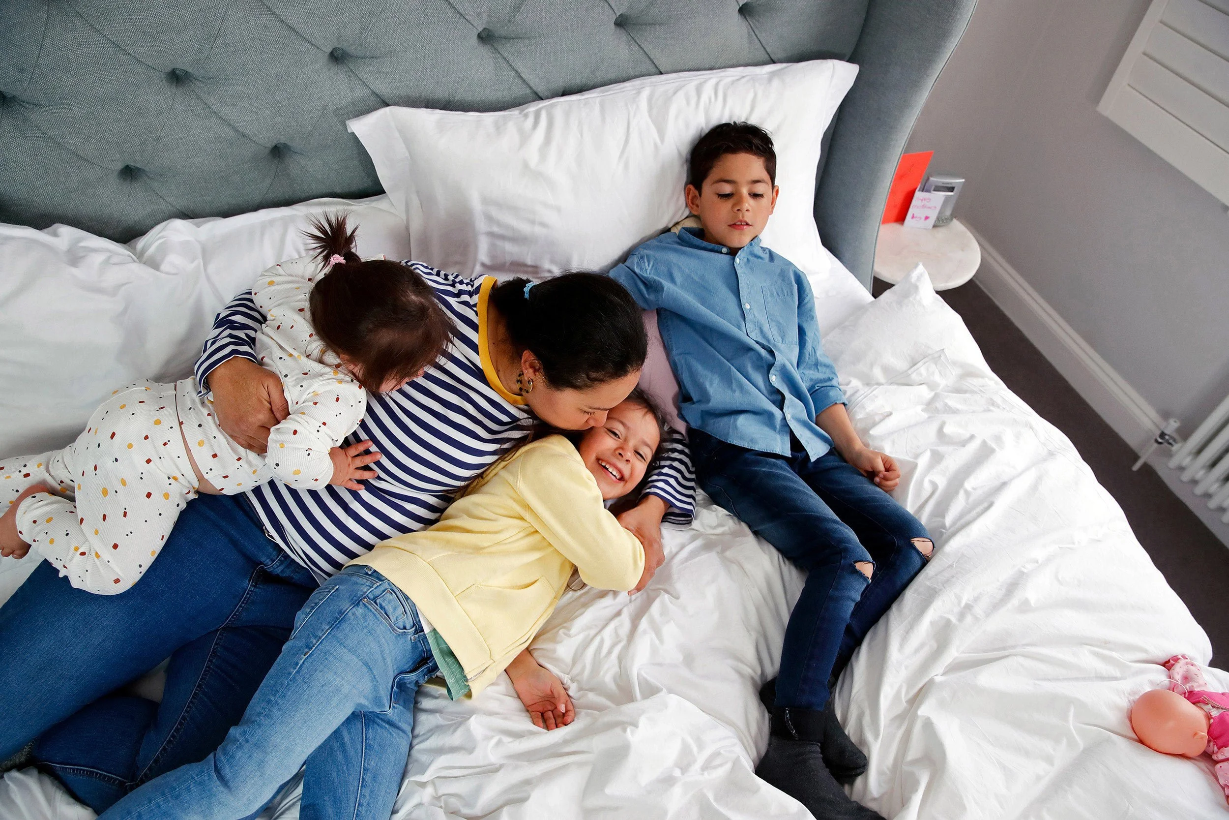 a-mother-and-her-children-cuddling-together.jpg