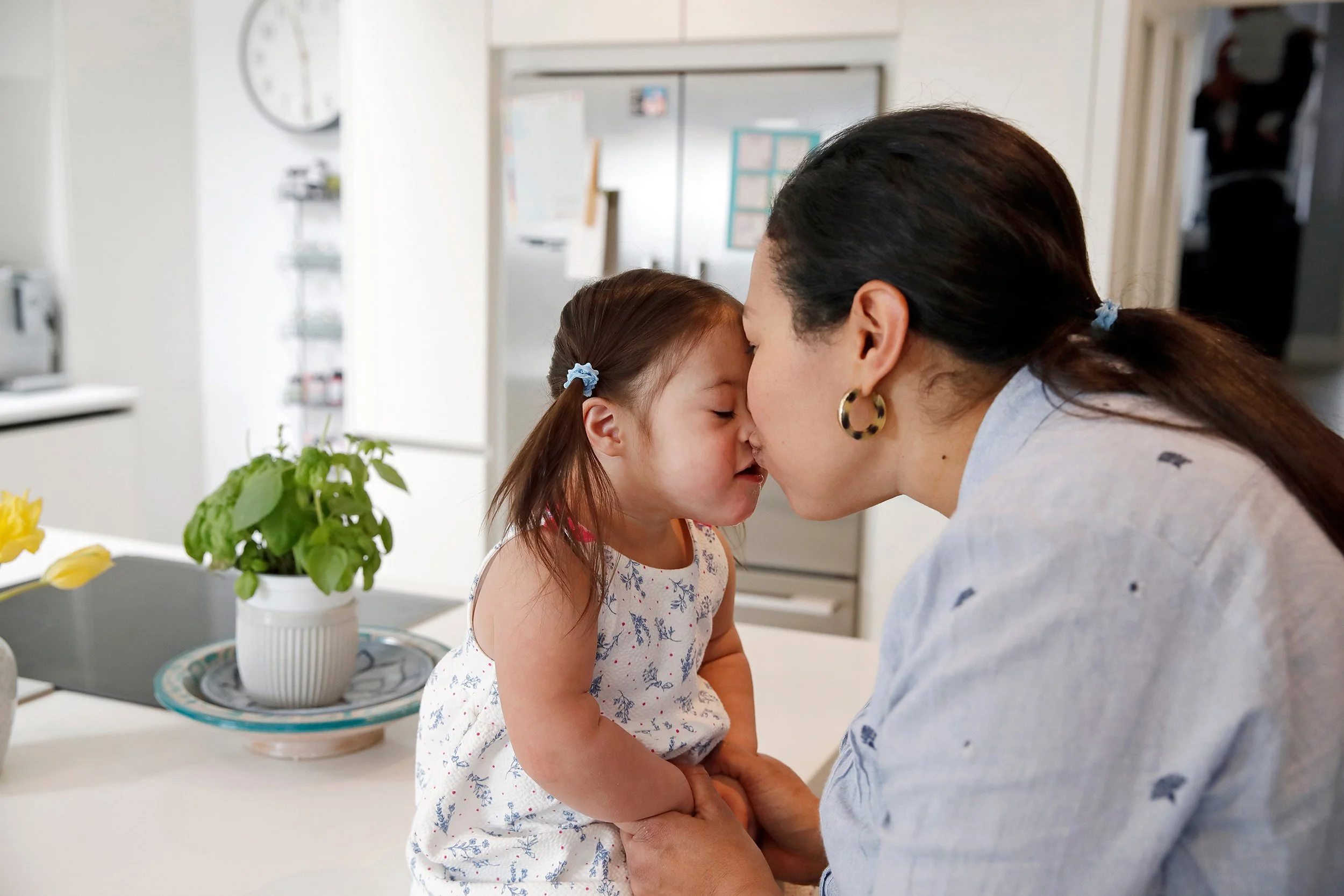 a-mother-kissies-her-young-dughter.jpg