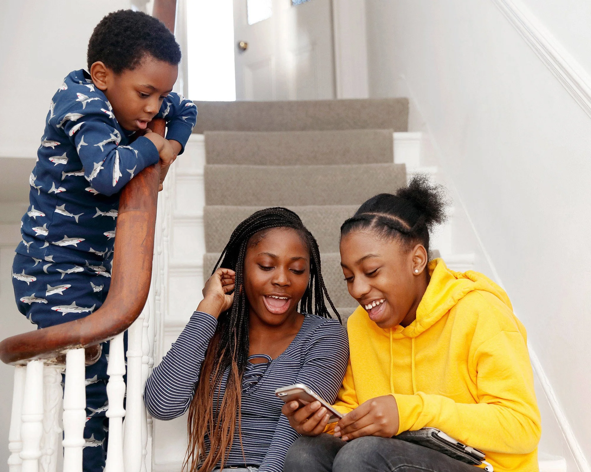 children-looking-at-a-mobile-phone-together.jpg