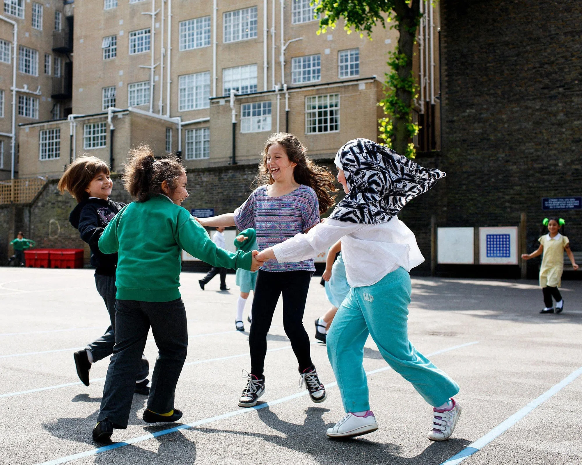 school-children-dancing-in-a-playground.jpg