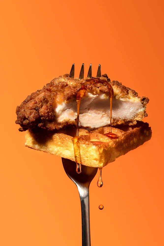 chicken, waffle and syrup on a fork.jpg