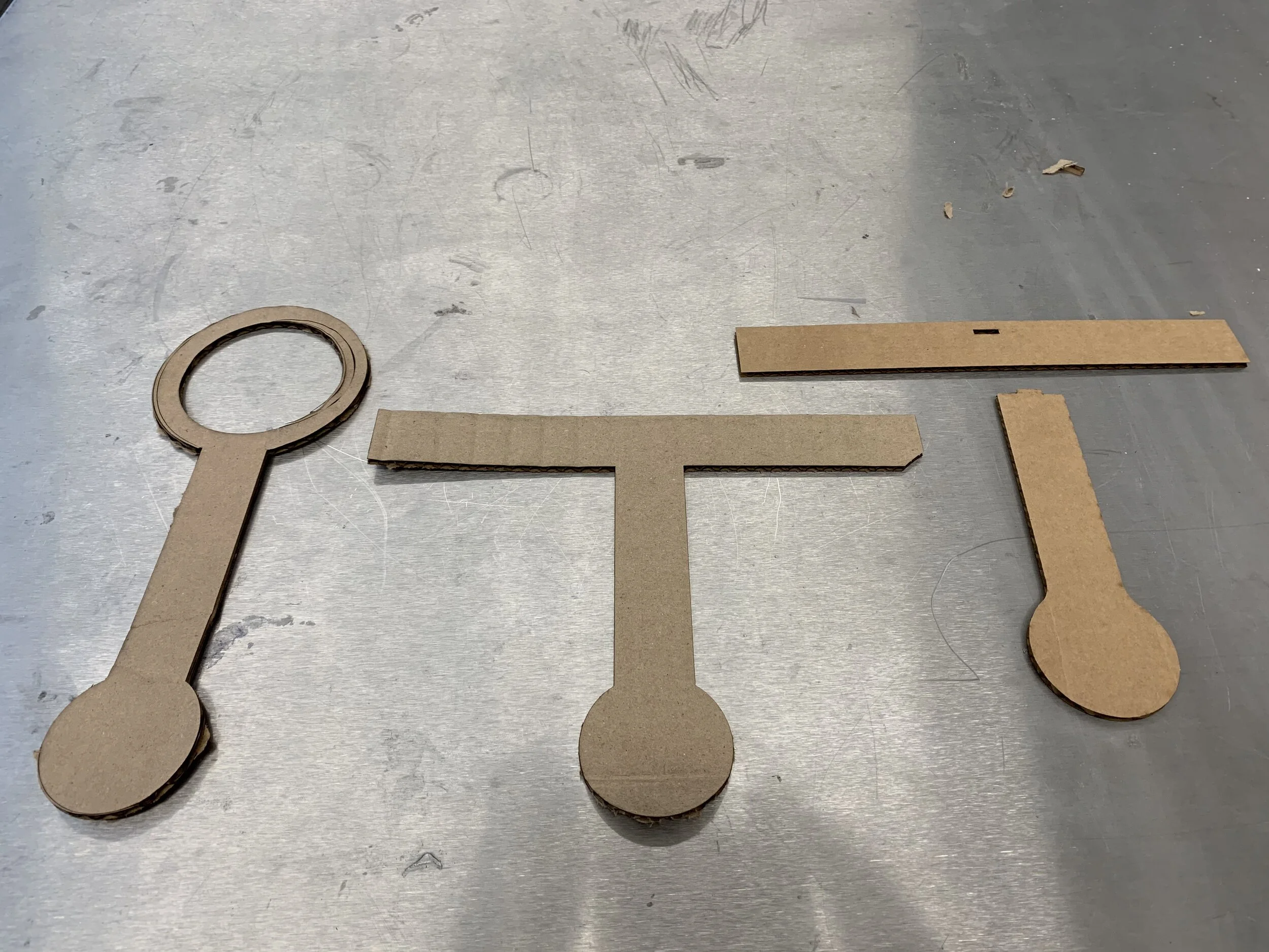 Initial prototyping done with cardboard. This was done to determine the approximate geometry needed to fit the coffee cup and trying different designs