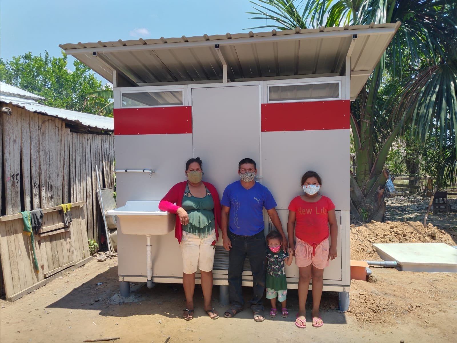  This is one extremely happy and healthy family in front of their very own bathroom! This has changed their life on so many levels, from better health and a new understanding of hygiene to implementing family values and building lasting legacies. Res