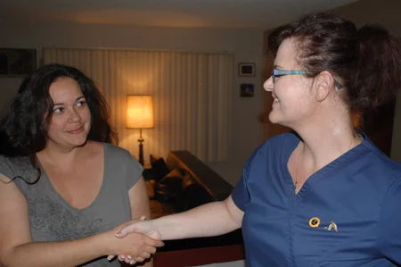 Happy_Female_Client_shakes_hands_with_Dr._Fox_after_treatment.jpg