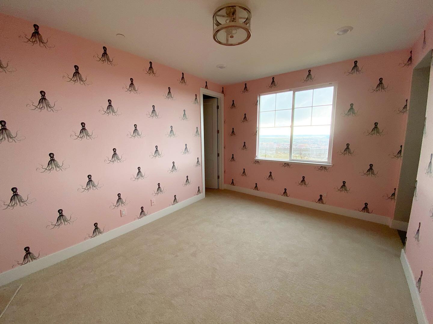 Jobs like this make us very grateful for our laser level! The horizontal came in very handy to make sure all the little octopi stayed in line. This was a hand trim wallpaper designed to overlap and double cut. However, the vertical match failed so we