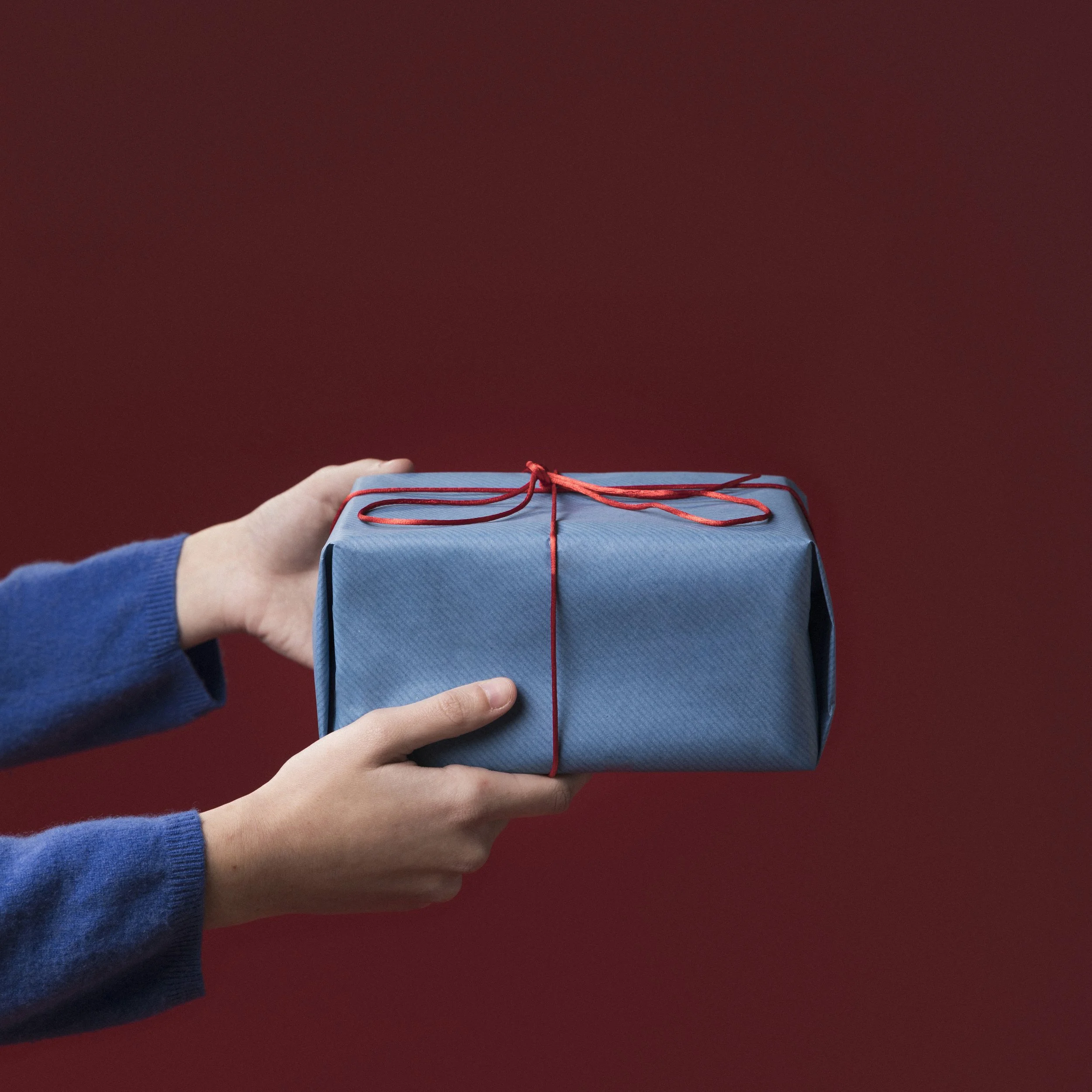 woman-holding-small-gift.jpg