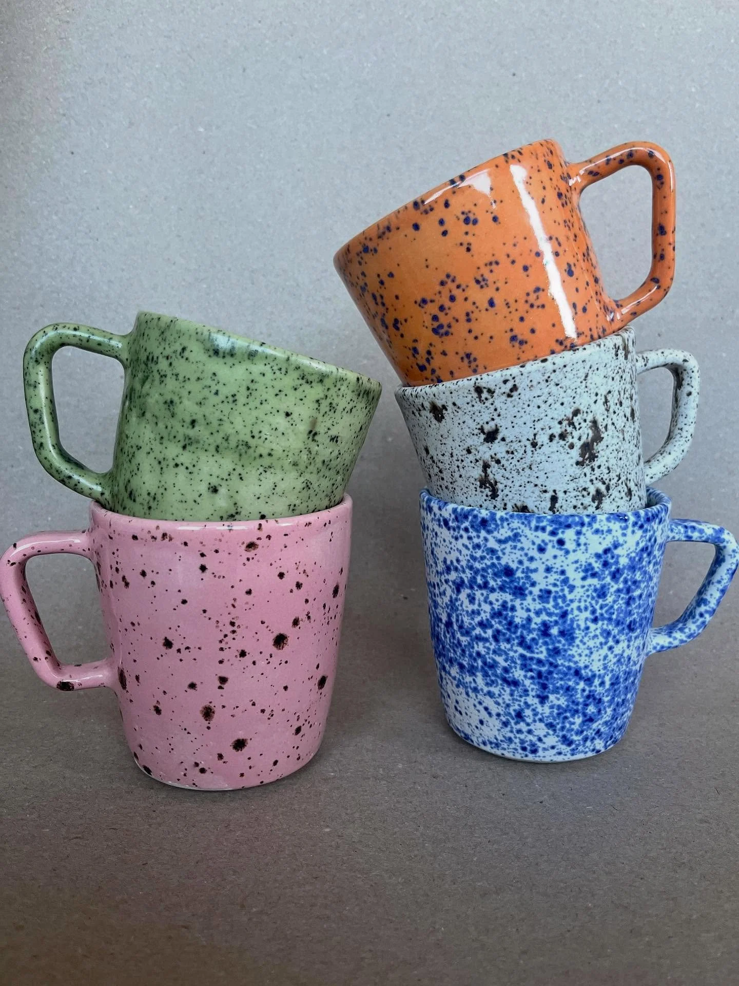 After a lot of trial and error, we are adding 3 new speckled glazes! Our old standbys of Blue Splatterware and Dalmatian Jasper have updated mug shapes too. We&rsquo;re obsessed with these new colors! Introducing Speckled Matcha, Speckled Peony, and 