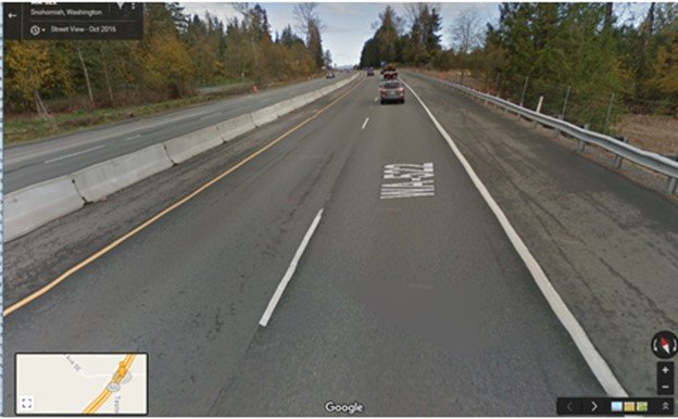 Road in Washington State with a median barrier