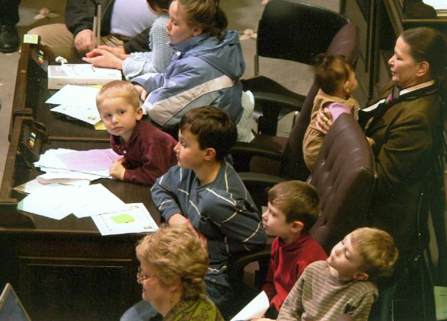 Lynn with her grandchildren in the legislative chamber.