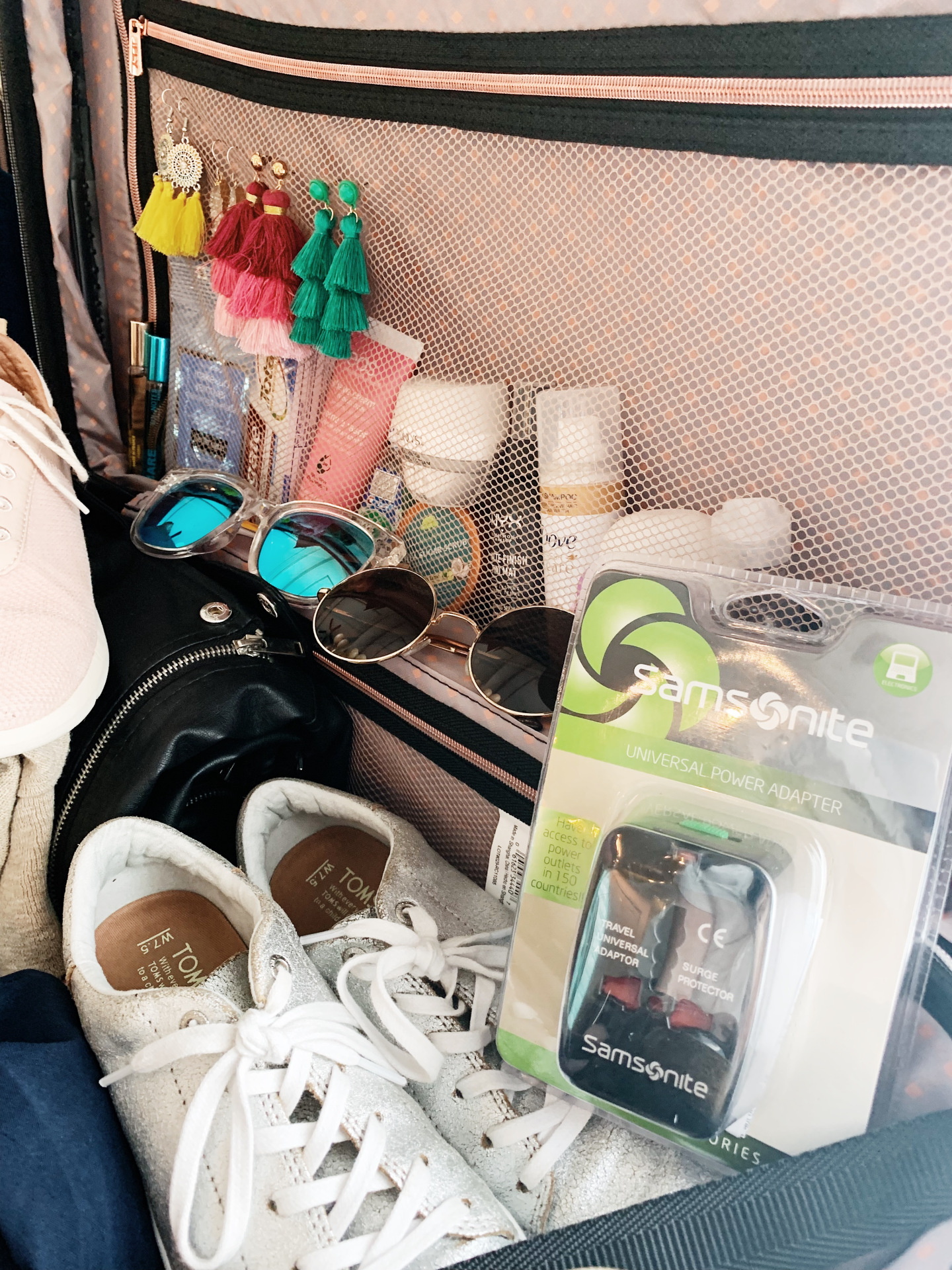 toiletries, sunglasses and shoes for tricks for packing