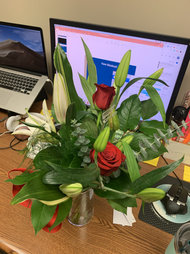 flowers in a vase and on a desk for Valentine's day
