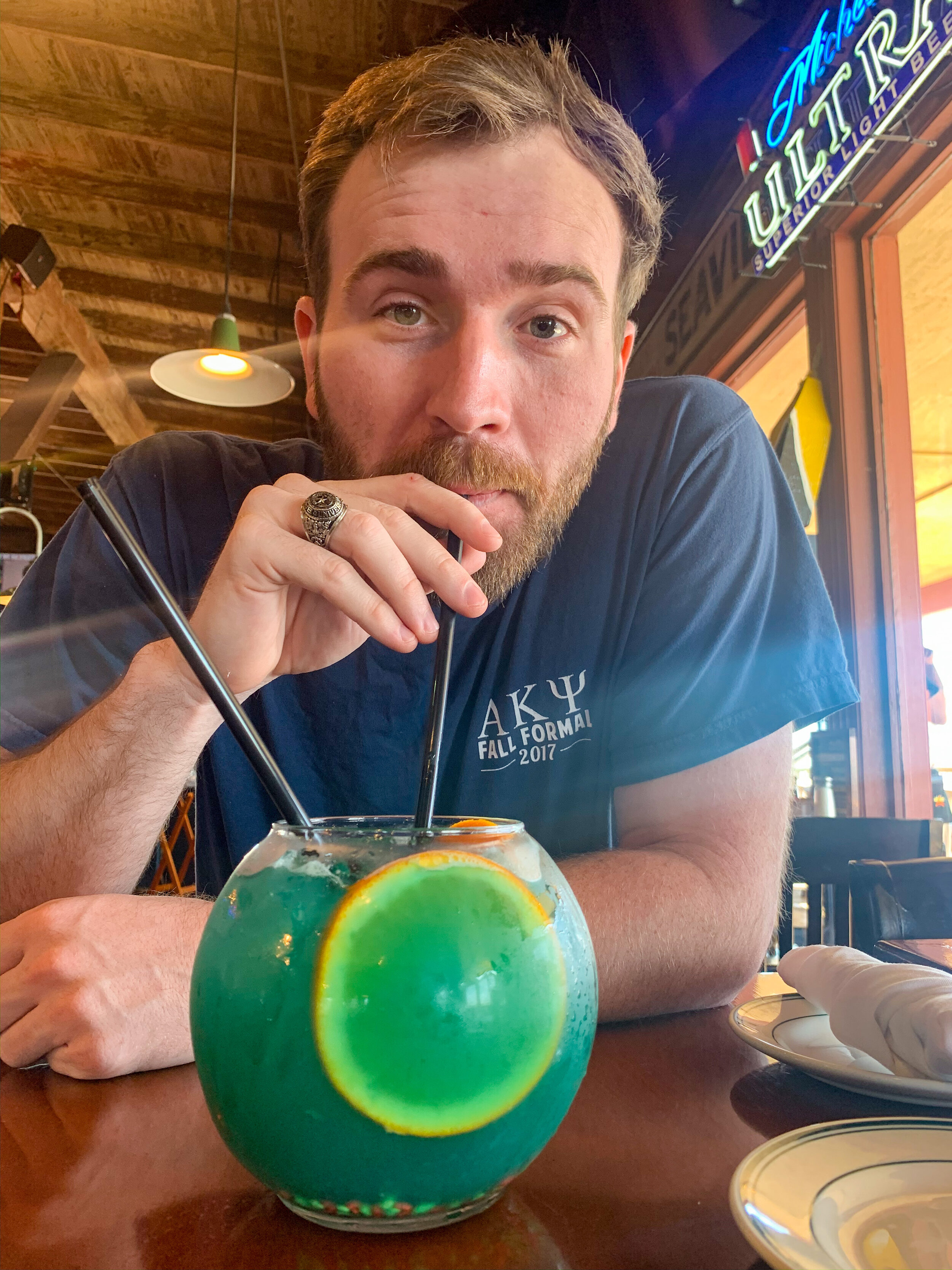 man drinking at a bar in Galveston