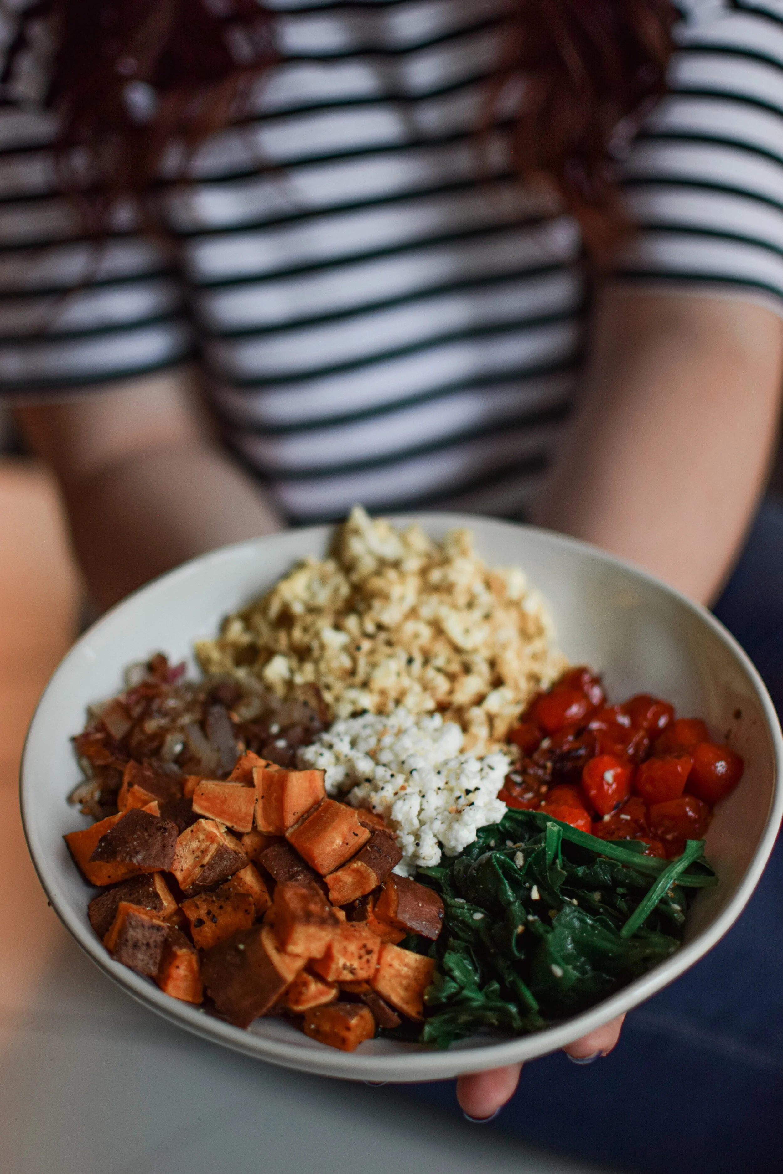 person holding a bowl of easy to make meal 