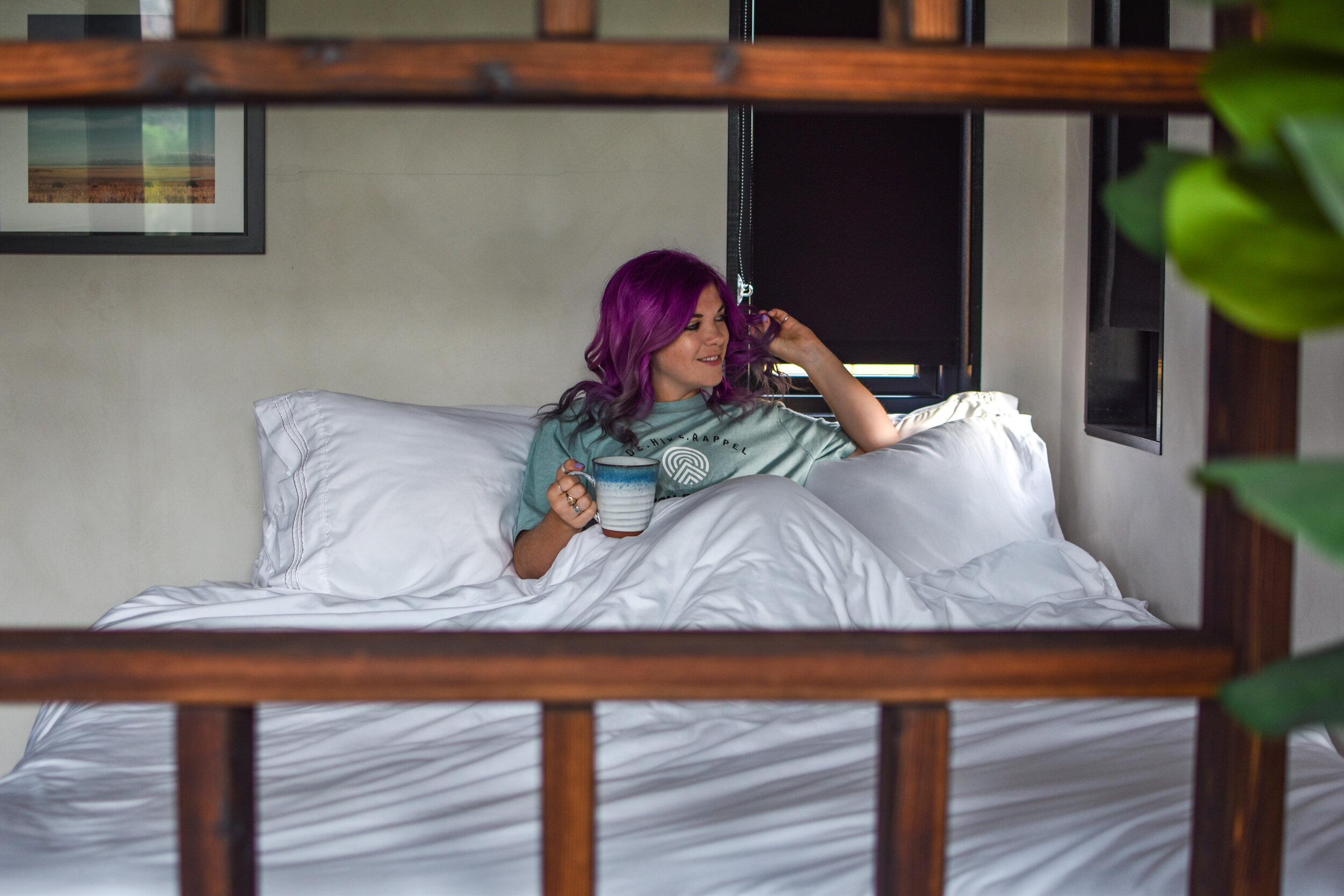 woman drinking coffee on the bed 